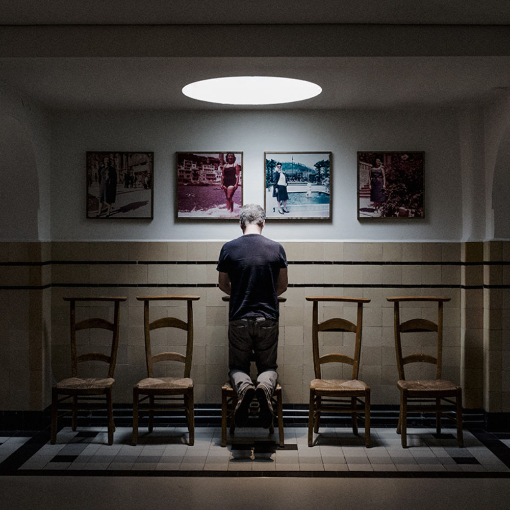 An environmental portrait of Pieter Leenderste in the KesselsKramer office. This intimate and symmetrical photograph shows Pieter in a reflective moment. The image was taken in the former monastery bakery of the church where the KesselsKramer office is located.